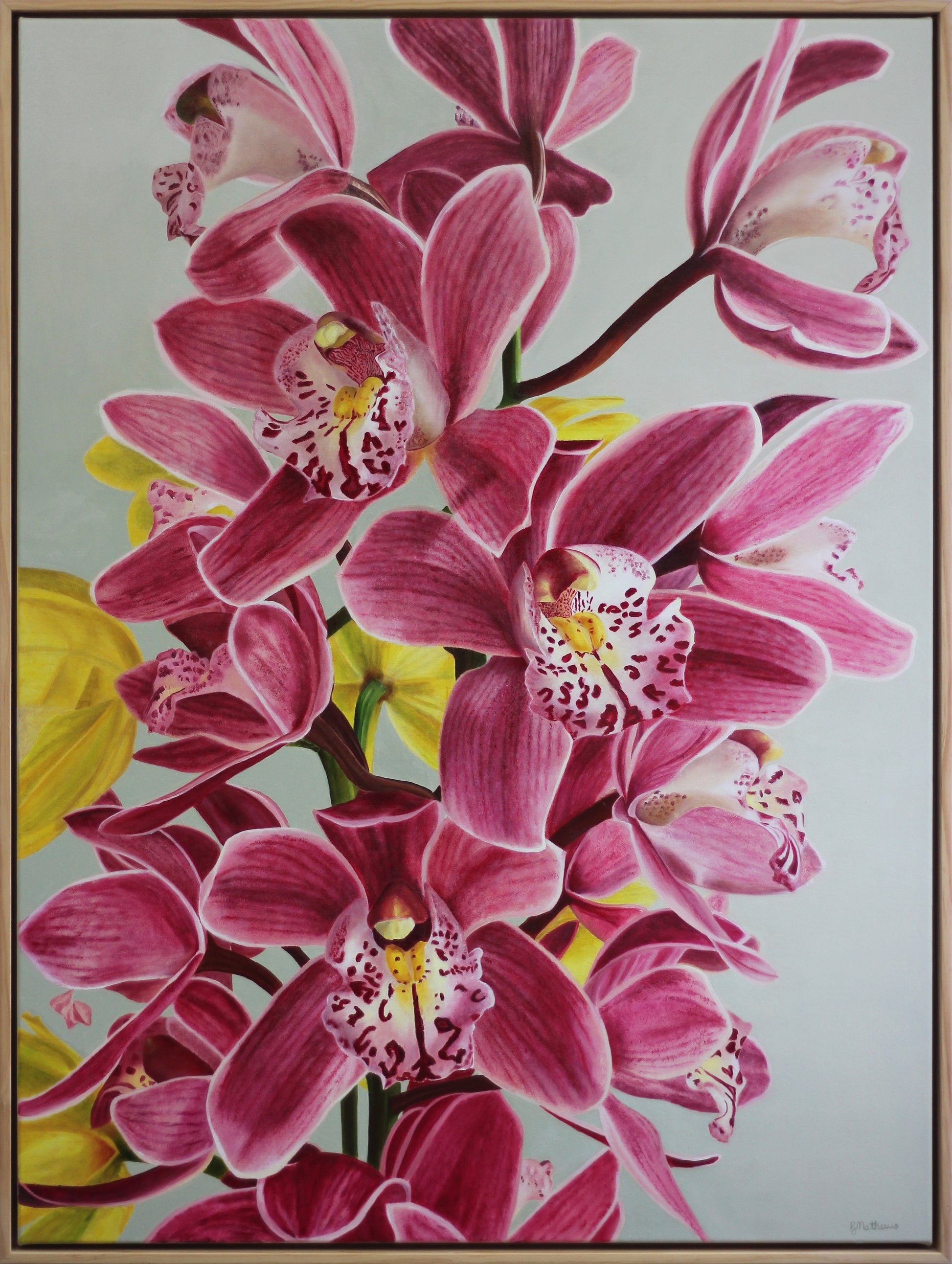 Framed artwork of pink orchids with a light gray green background
